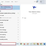 Giao diện tìm kiếm Windows Start hiển thị tùy chọn "Xem lịch sử độ tin cậy".