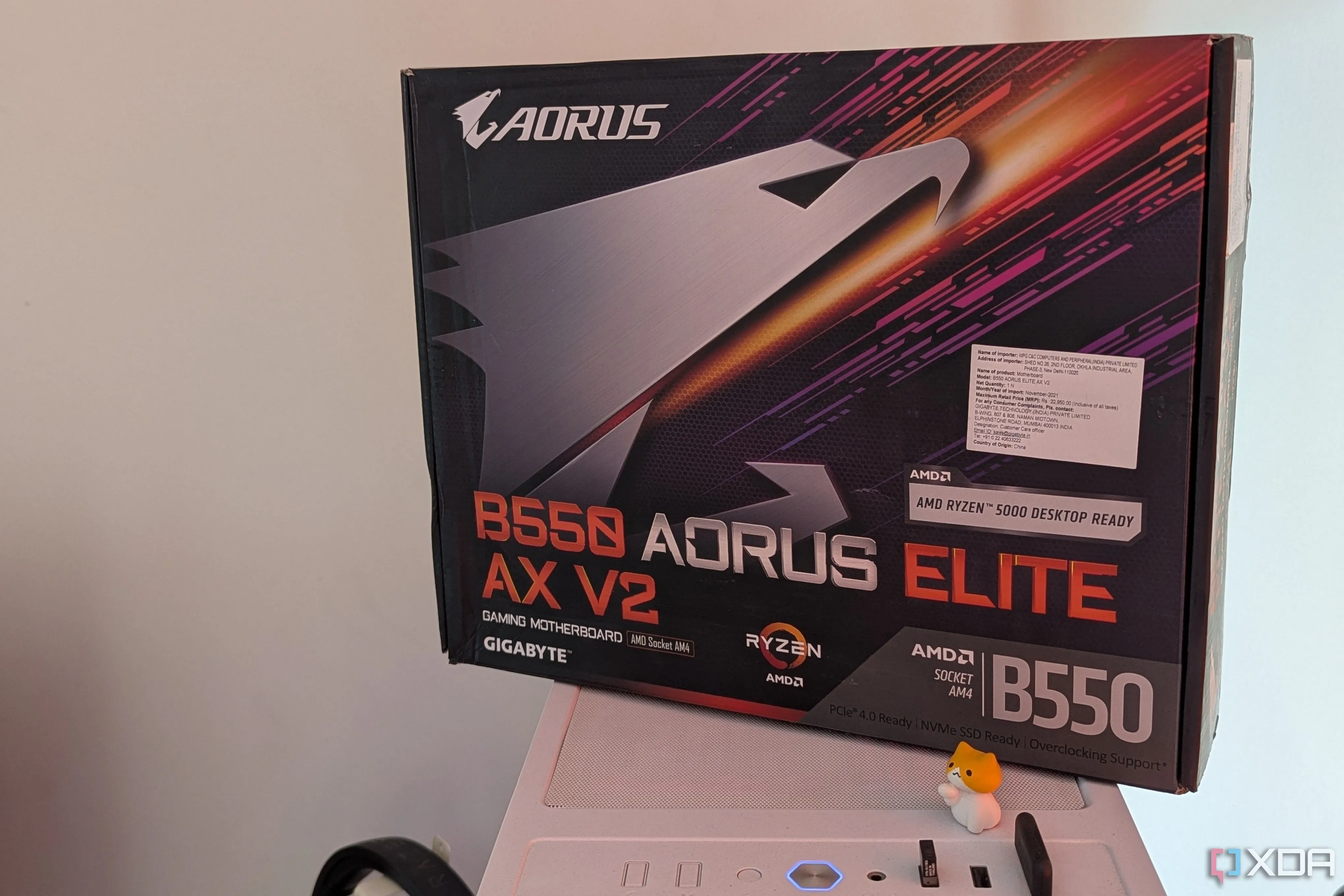 A Gigabyte motherboard box on top of a white PC case