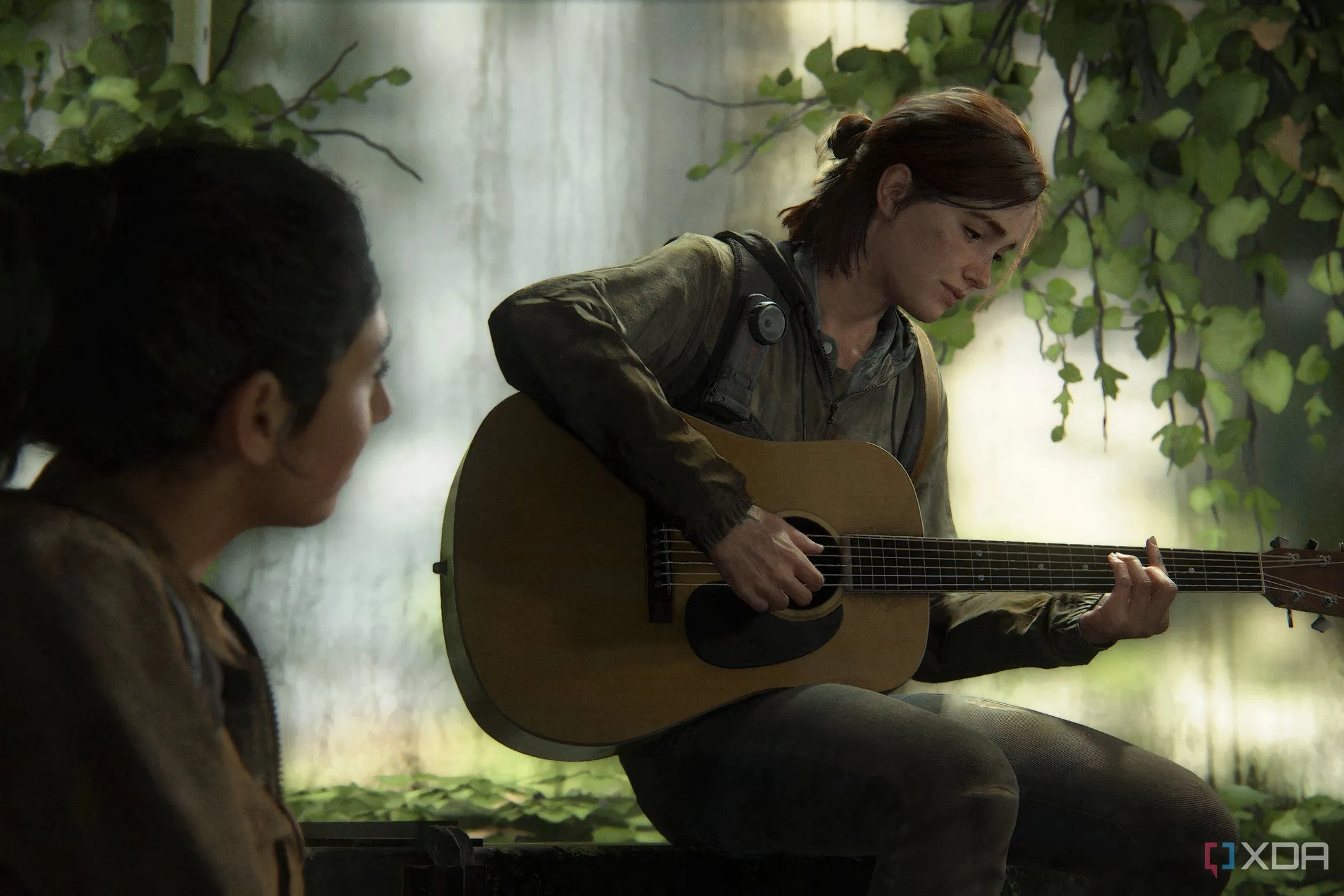 Ảnh chụp màn hình từ The Last of Us Part II, cho thấy Ellie chơi guitar