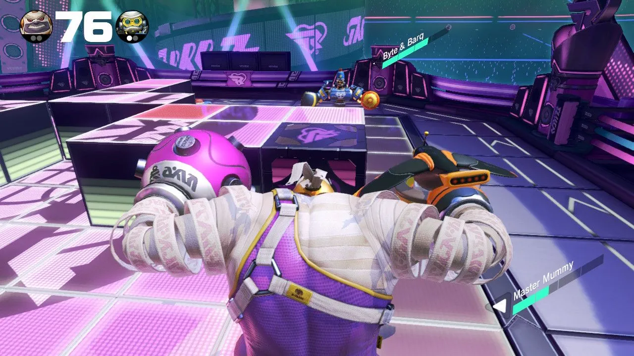 Cảnh chiến đấu trong game ARMS trên Nintendo Switch với nhân vật có cánh tay dài đặc trưng