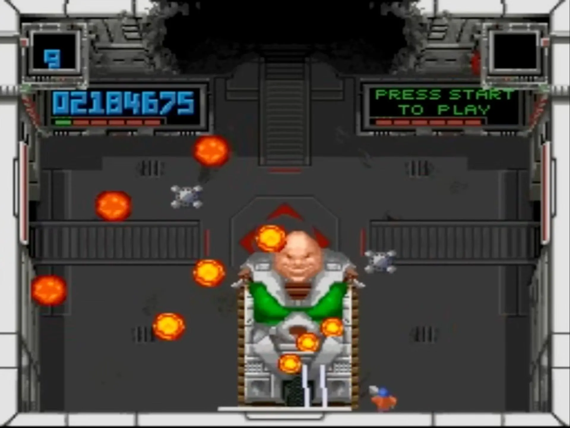 Cảnh chơi game bắn súng góc nhìn từ trên xuống Super Smash TV trên SNES, hiển thị nhân vật người chơi đang chiến đấu với nhiều kẻ địch trên màn hình