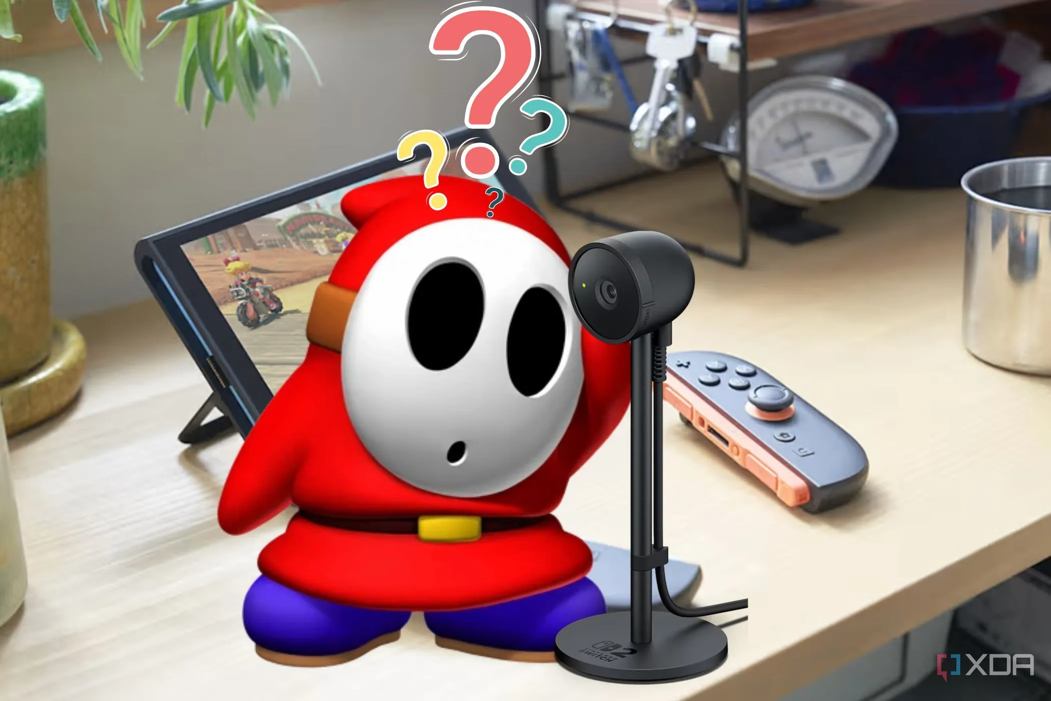 Hình ảnh minh họa Nintendo Switch 2 với biểu tượng camera và nhân vật Shy Guy, thể hiện sự bối rối trước những thay đổi công nghệ