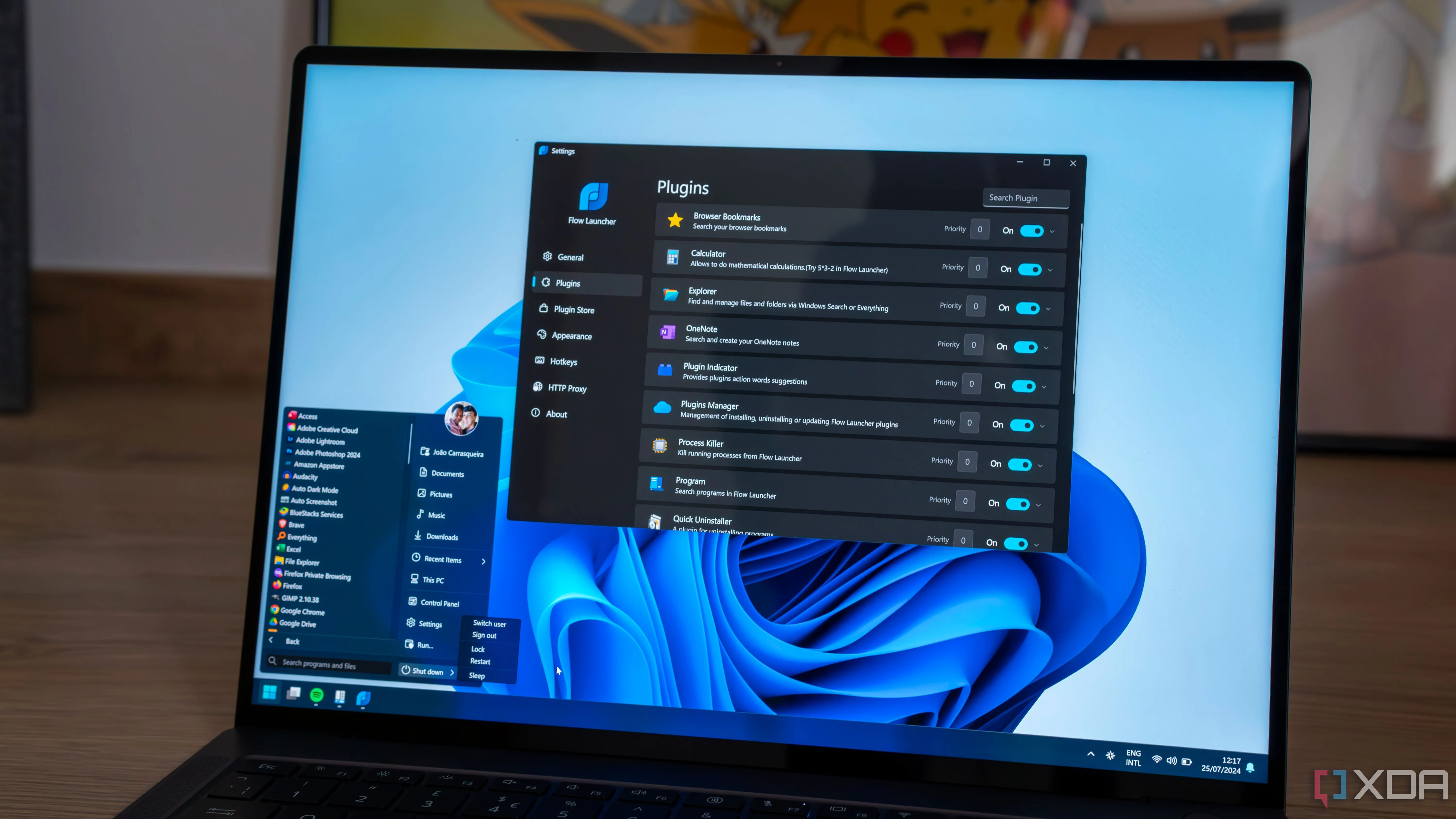 Laptop Windows 11 với menu Start tùy chỉnh và một cửa sổ ứng dụng launcher đang mở