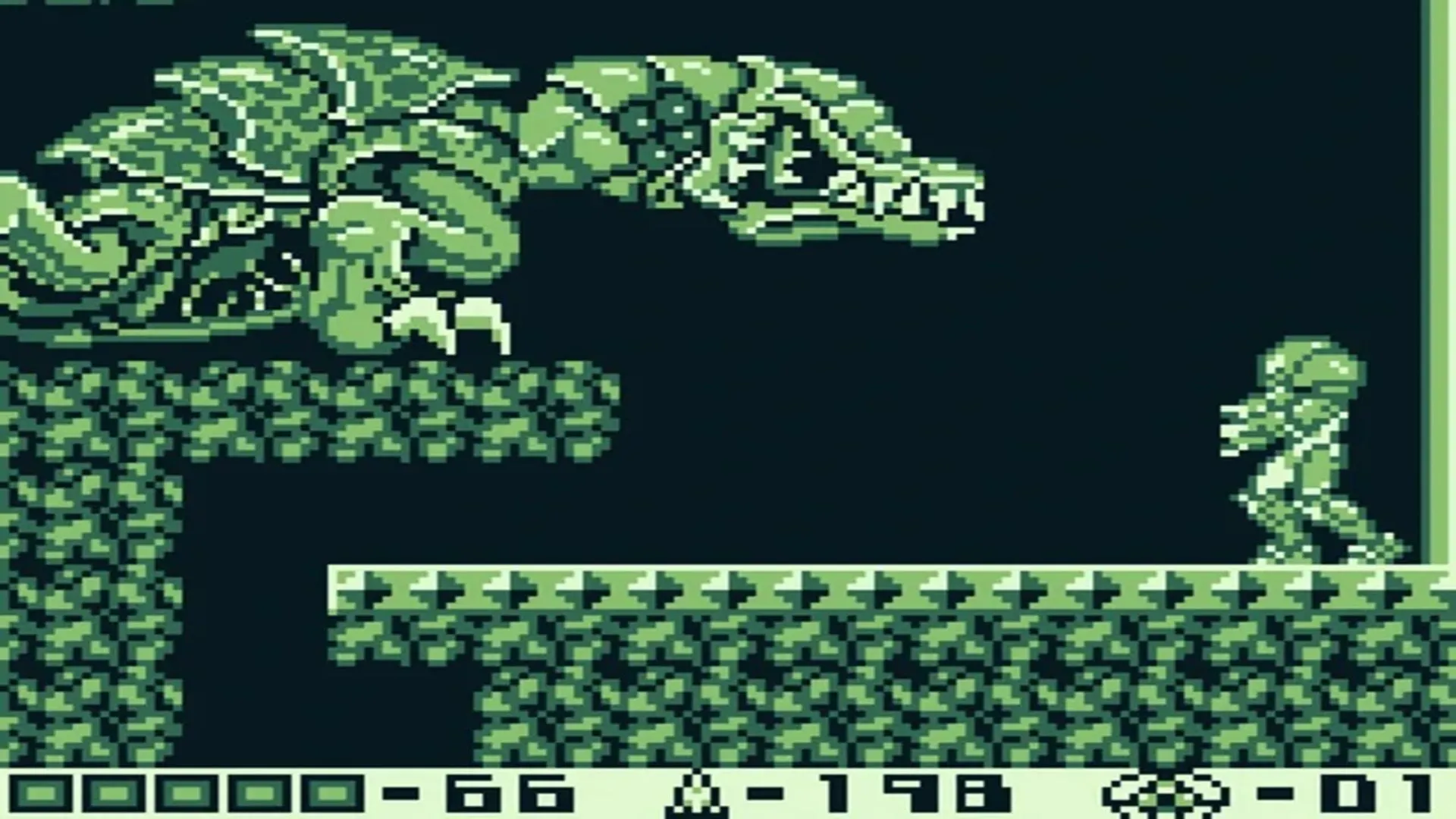 Màn hình gameplay Metroid II: Return of Samus trên Game Boy, với đồ họa đơn sắc và Samus Aran trong bộ Power Suit.