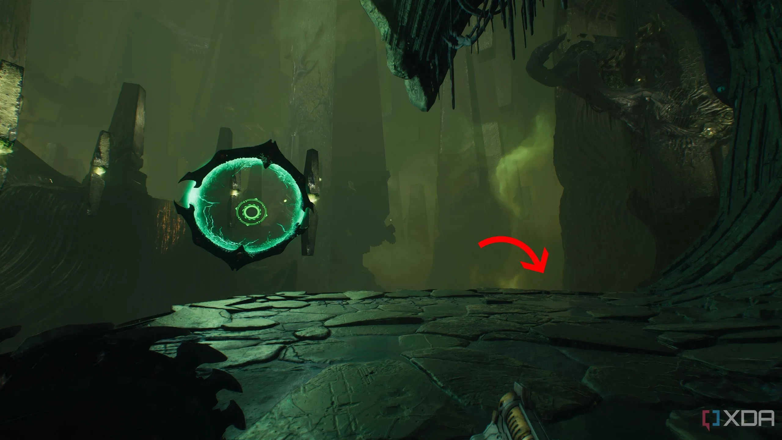 Mũi tên chỉ xuống bên phải cạnh Shield Portal trong chương 15 của Doom The Dark Ages