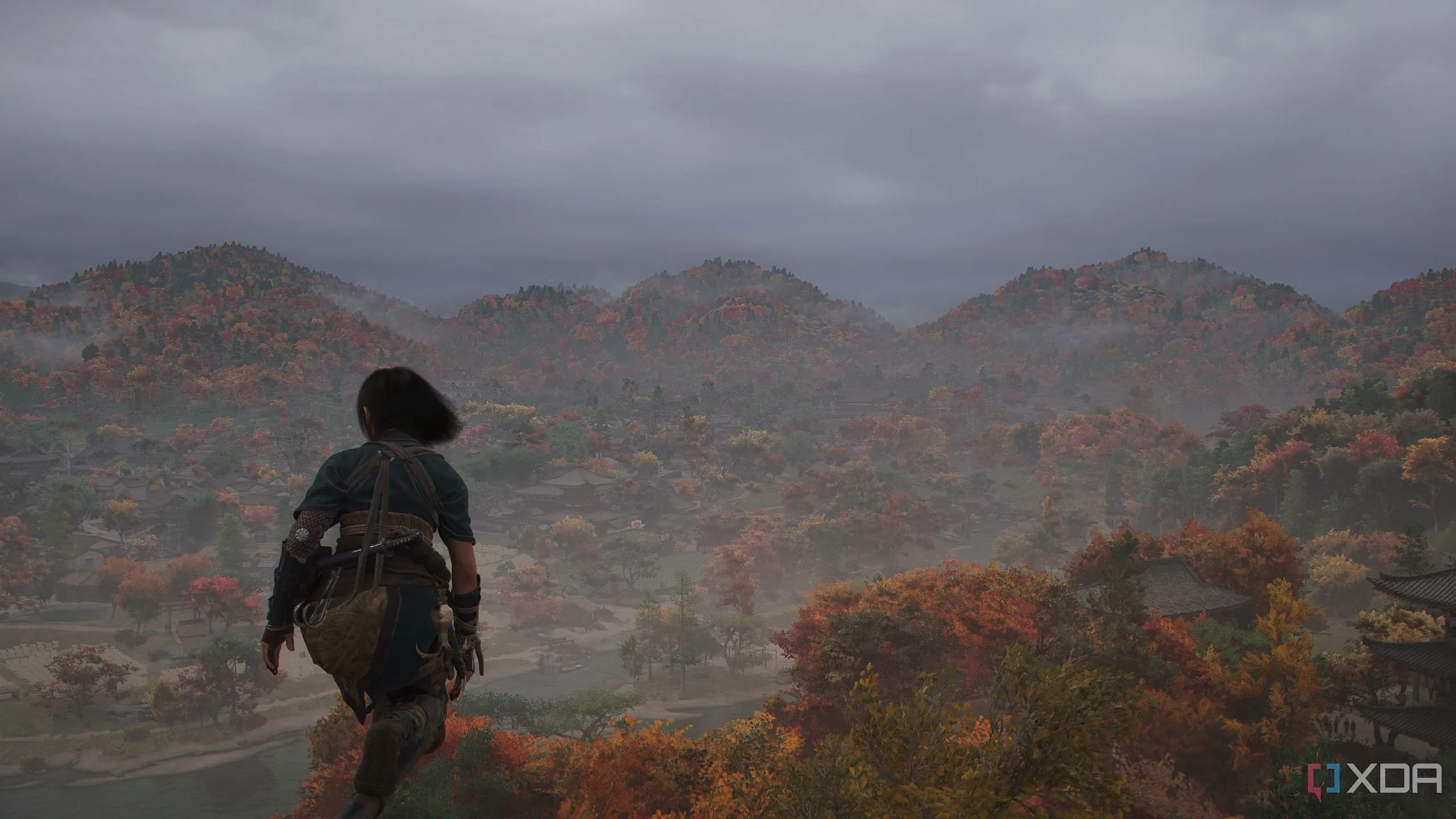 Naoe nhìn ra xa với mái tóc bay trong gió, sẵn sàng cho Photo Mode của Assassin's Creed Shadows