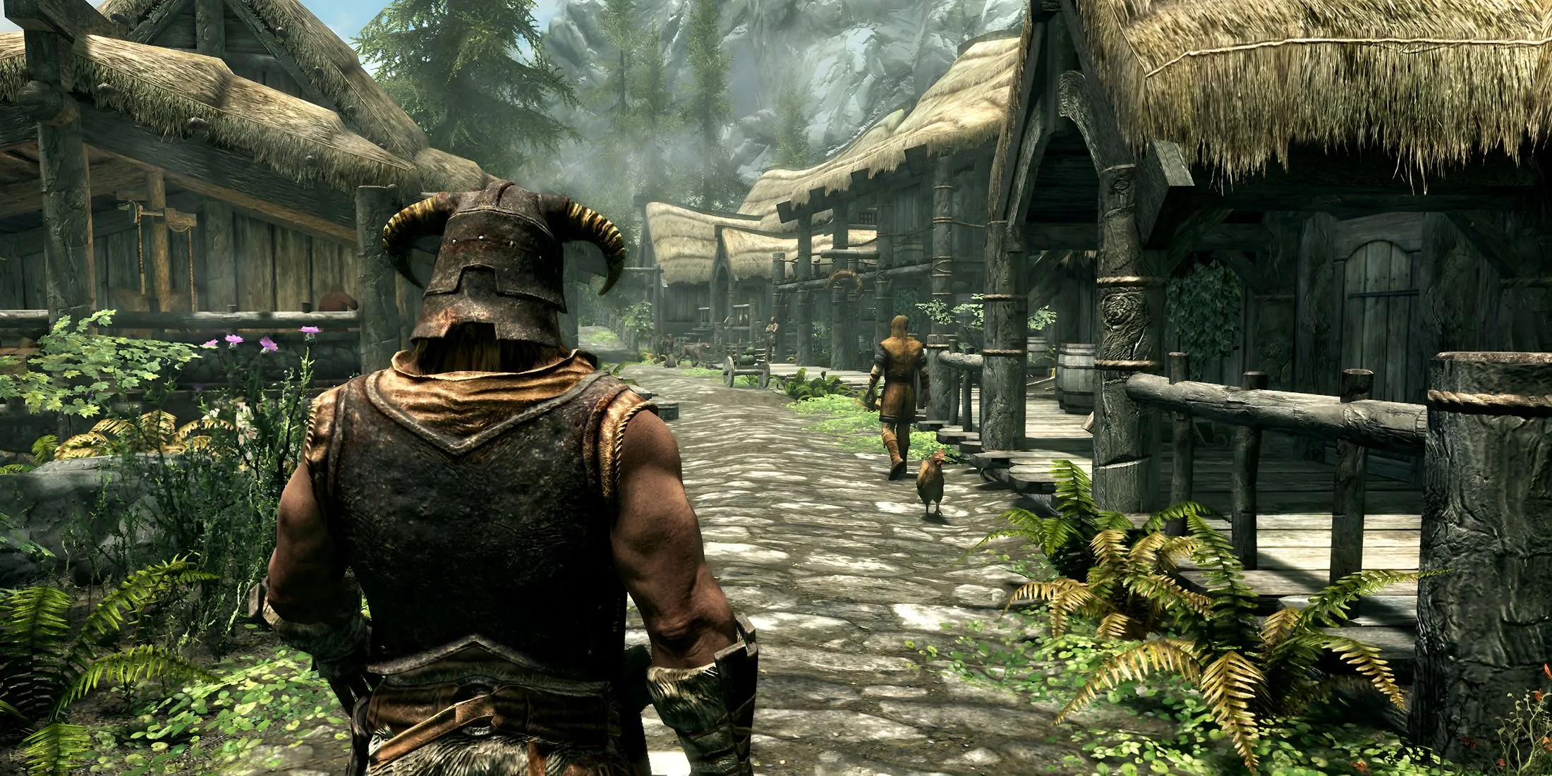 Nhân vật Dragonborn của Skyrim đứng giữa một ngôi làng, thể hiện sự nhập vai cao